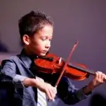 Young violinist of Ruscica Music playing at the Jessup lecture hall