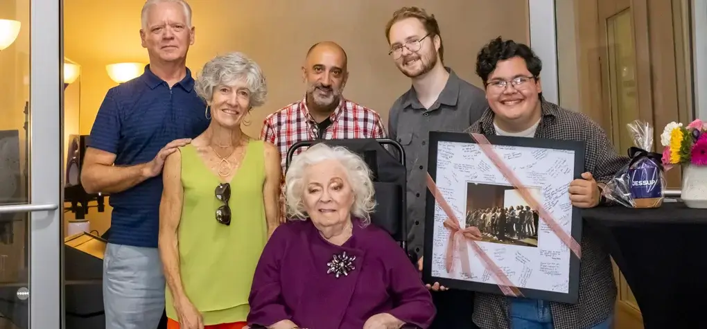 Tom Ruscica standing with Jessup Studio donor Judy Holsinger