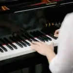 Ruscica Music pianist using grand piano at the Jessup lecture hall