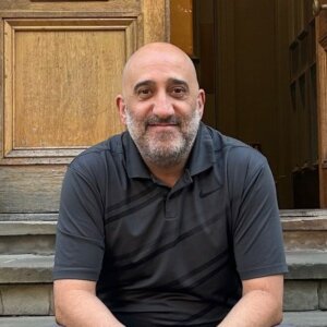 Tom Ruscica sitting on steps